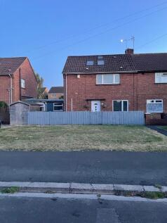 A charming semi-detached brick house with a wel...