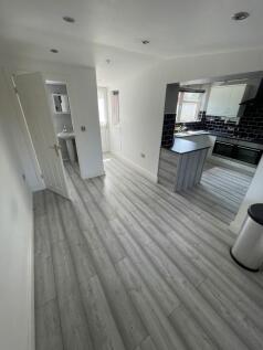 Bright and modern kitchen space featuring sleek...