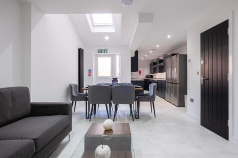 Stylish and spacious living area featuring mode...