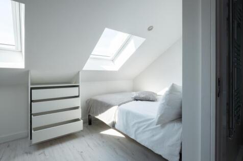 A bright and inviting double bedroom featuring ...