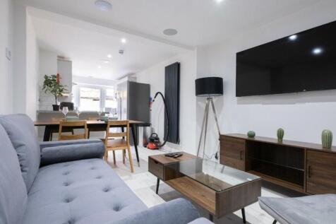 A spacious and modern living room with stylish ...