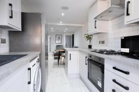 A modern and inviting kitchenette featuring sle...