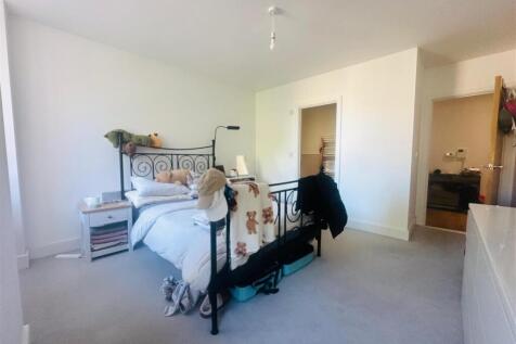 Bright and inviting master bedroom featuring a ...