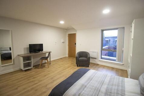 Bright and spacious master bedroom featuring a ...
