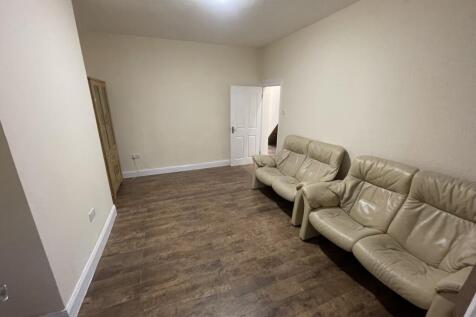 A spacious and inviting living room featuring c...
