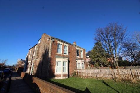 A charming detached brick house with large wind...