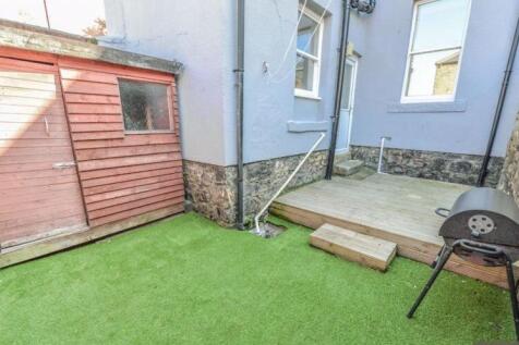 Well-maintained private garden area featuring a...