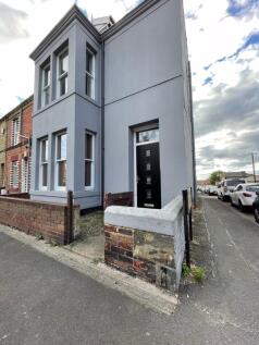 Modern terraced house exterior with clean grey ...