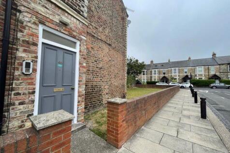 A charming terraced house entrance with classic...