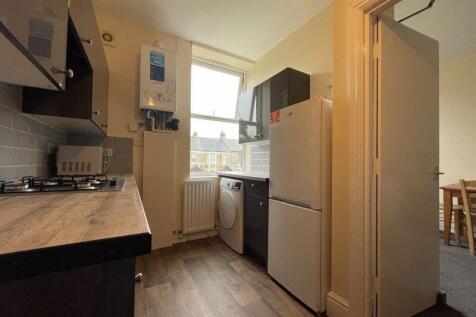 A compact, well-maintained kitchen featuring mo...