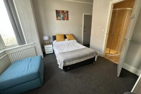 Bright and inviting master bedroom featuring a ...