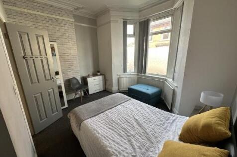 Bright and cozy double bedroom featuring a comf...