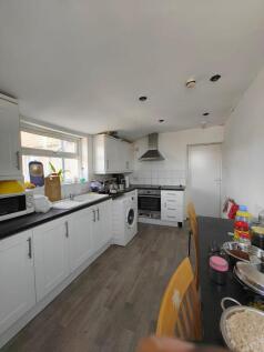 Bright and functional kitchen featuring ample c...
