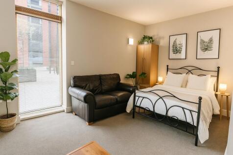 Bright and inviting master bedroom featuring a ...
