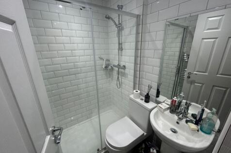 A modern and well-maintained bathroom suite fea...