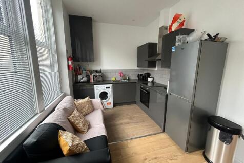 Bright and modern kitchen featuring contemporar...
