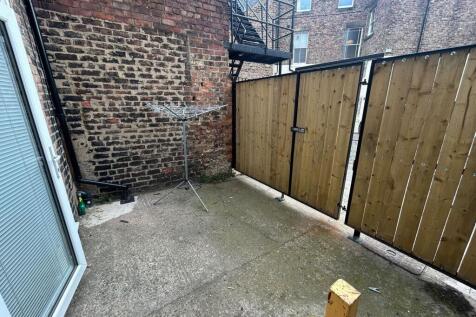 A compact and private outdoor garden space feat...