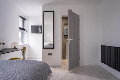 Bright and inviting double bedroom featuring a ...