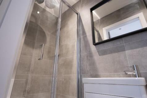 A modern bathroom featuring sleek fixtures, a s...