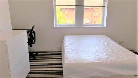 Bright and tidy double bedroom featuring a comf...