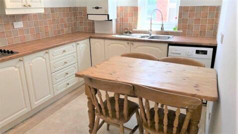 Bright and functional kitchen featuring a tradi...