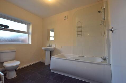 Bright bathroom suite featuring a spacious bath...