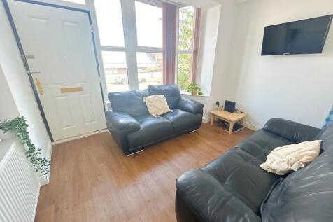 Bright and cozy living room featuring comfortab...