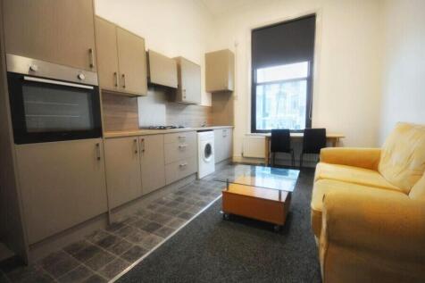 Bright and functional kitchen-living space feat...