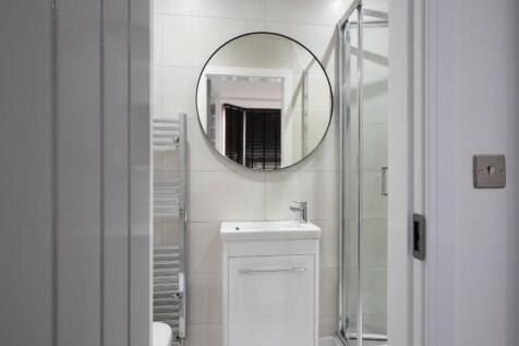 Contemporary bathroom featuring a sleek design ...