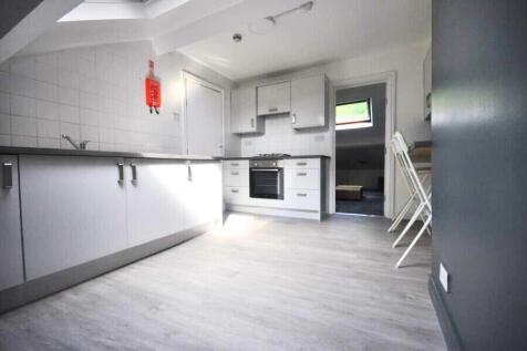 Bright and modern kitchen with ample counter sp...