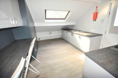 Bright and modern kitchen featuring sleek count...