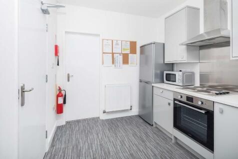 Modern kitchen equipped with essential applianc...