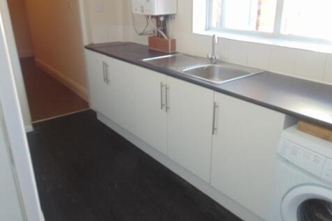 Bright kitchen with ample counter space, white ...