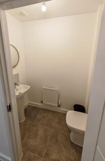 A clean and well-maintained single toilet room ...