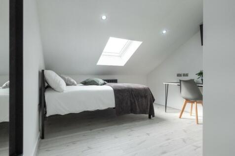 A modern and stylish double bedroom with ample ...