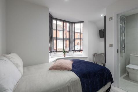 Bright and inviting double bedroom featuring a ...