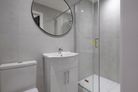 This modern bathroom features a stylish design ...