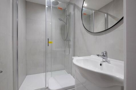 This modern bathroom features a sleek design wi...
