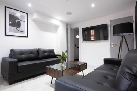 This stylish living room features contemporary ...