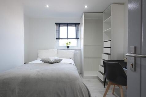 Cozy and modern double bedroom featuring ample ...