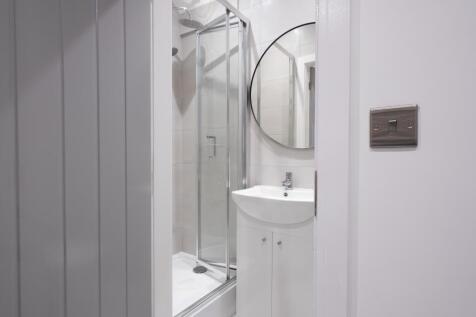 A modern bathroom featuring a sleek design with...