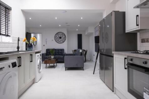 A modern and spacious kitchen area with ample n...