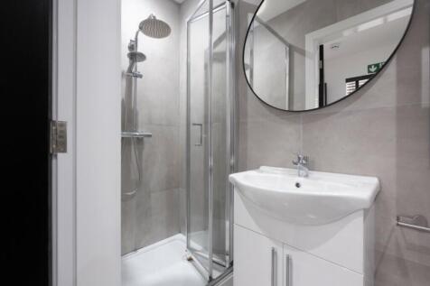 A modern bathroom featuring a sleek design with...