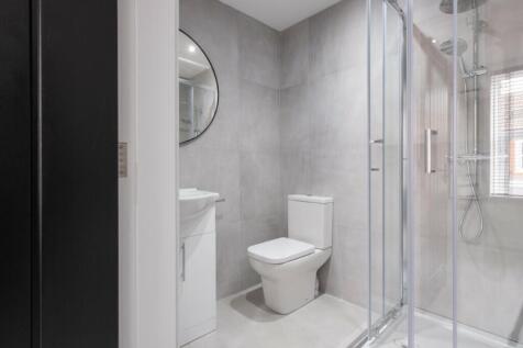A modern bathroom featuring sleek fixtures and ...