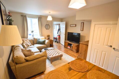 A cozy and inviting living room featuring a com...