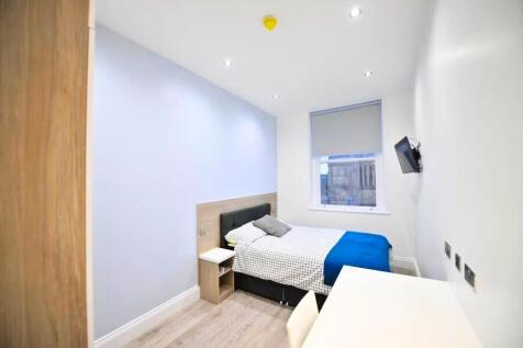 Bright and modern double bedroom featuring a co...