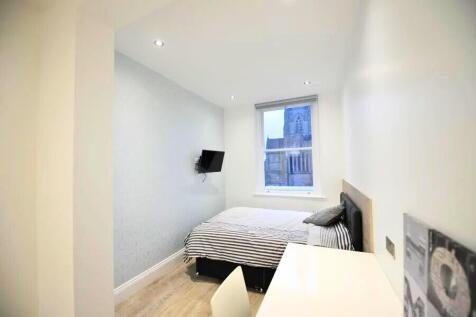 Bright and modern double bedroom featuring a co...