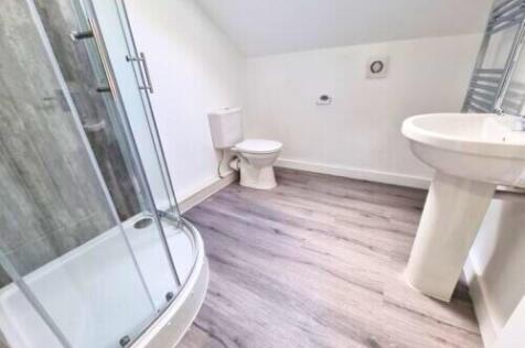 Bright and modern bathroom featuring a spacious...