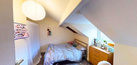 Cozy double bedroom with a comfy bed, natural l...