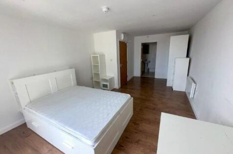 Bright and spacious master bedroom featuring a ...